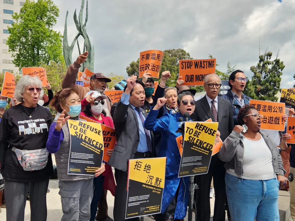 Supporters of Alameda County District Attorney Pamela Price rally to her defense during a "Refuse to be Silenced" demonstration outside the county administration building in Oakland on April 26, 2024. The group opposes efforts to recall Price, arguing that a special election will be costly and that signature gatherers resorted to "dirty tricks" to have the matter placed on the ballot. Alameda County Supervisors are expected to set a date for the recall vote sometime within the next two weeks. (Kiley Russell/Bay City News)